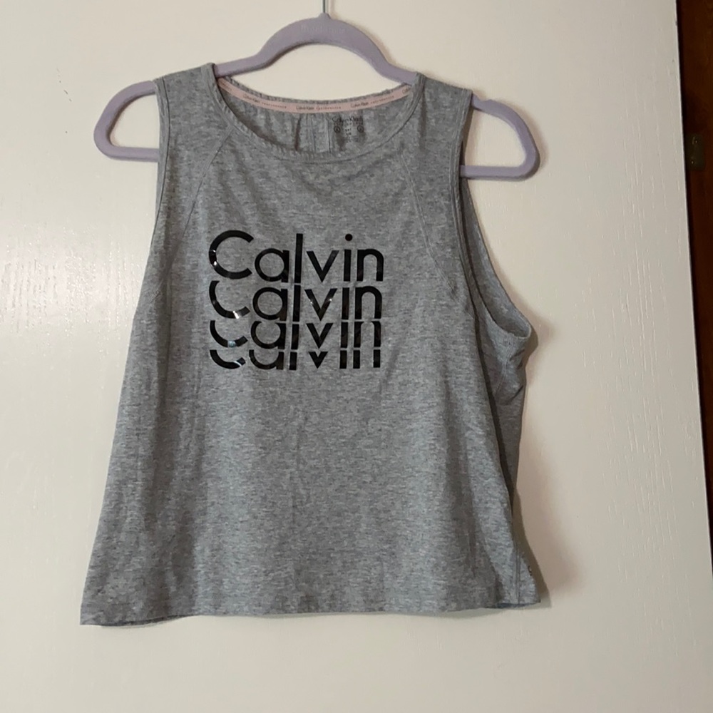 Sleeveless Calvin Klein workout shirt w/ cutouts in the back